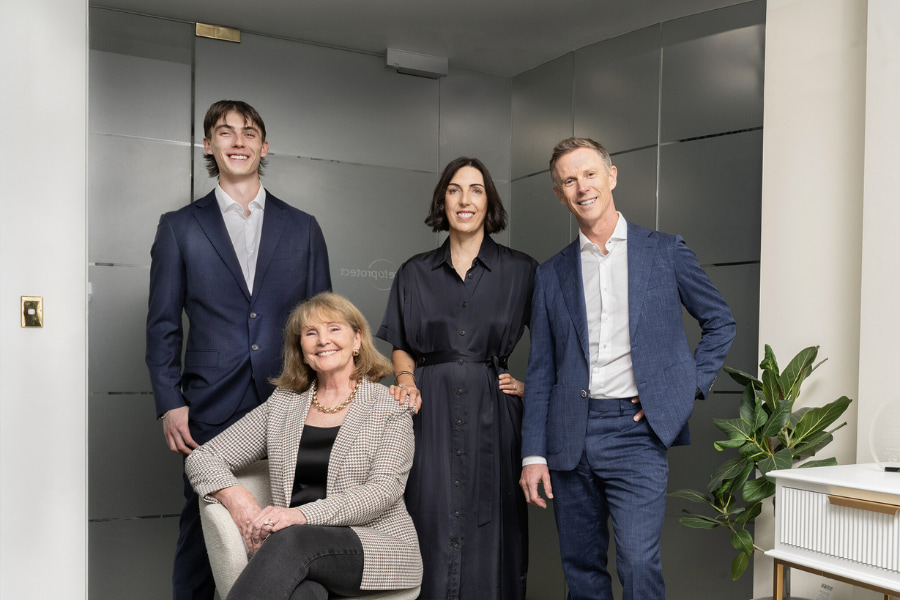 Care to Protecth team, four people in office setting